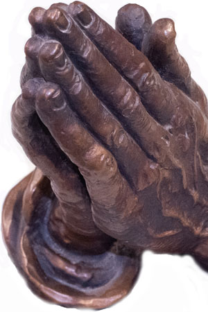 Praying hands sculpture